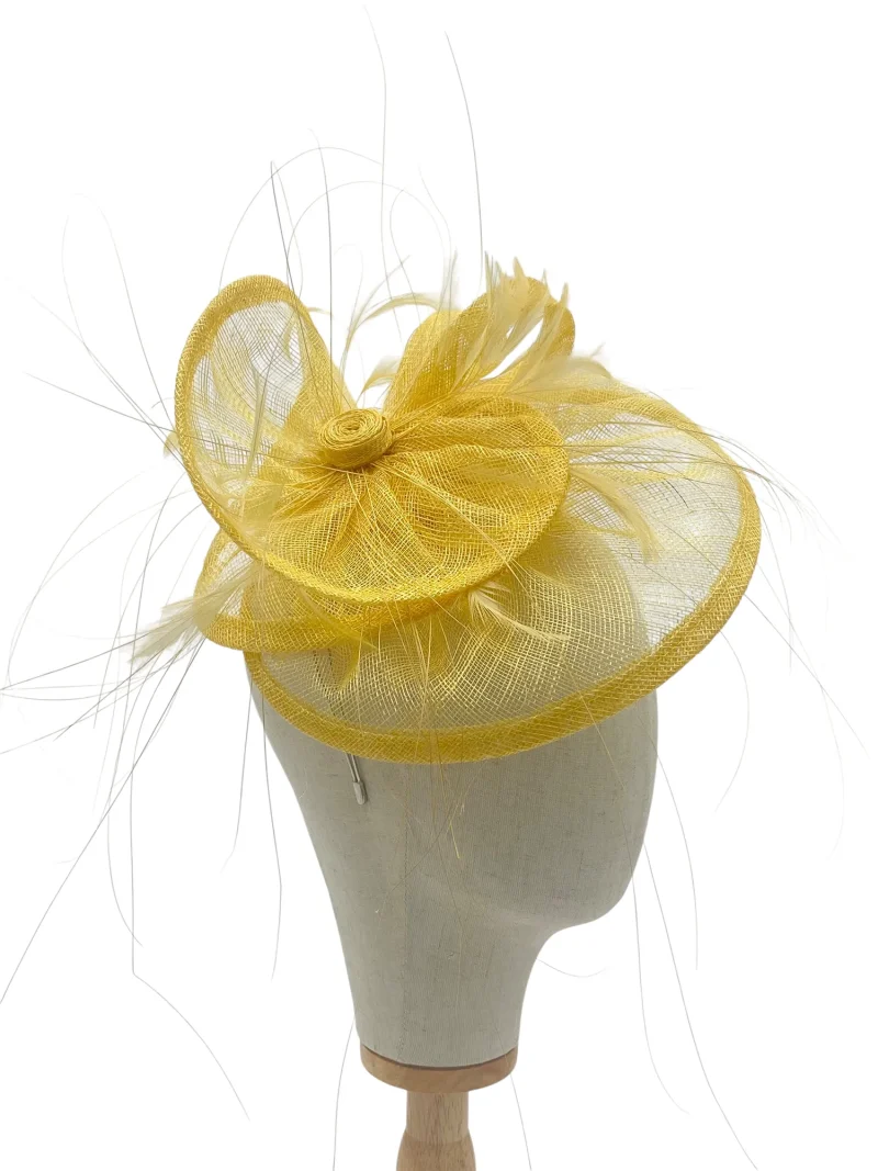 Lemon tiered saucer hatinator with fine feathers, side profile on a mannequin head