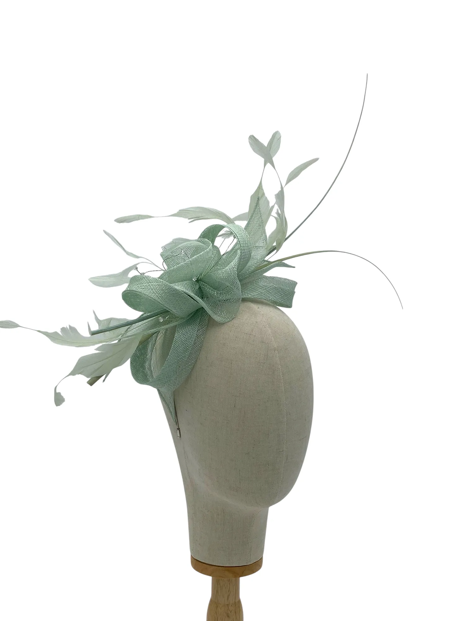 Aqua sinamay wedding or races fascinator with looped sinamay and feather spray, three-quarter view on a mannequin head