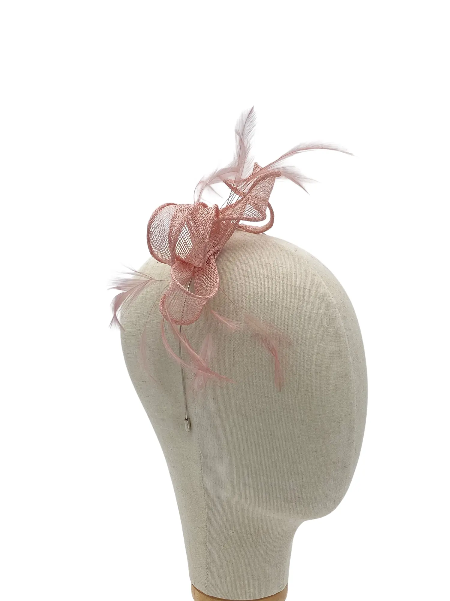 Beige dress form with a pink fascinator featuring netted loops and delicate feathers.
