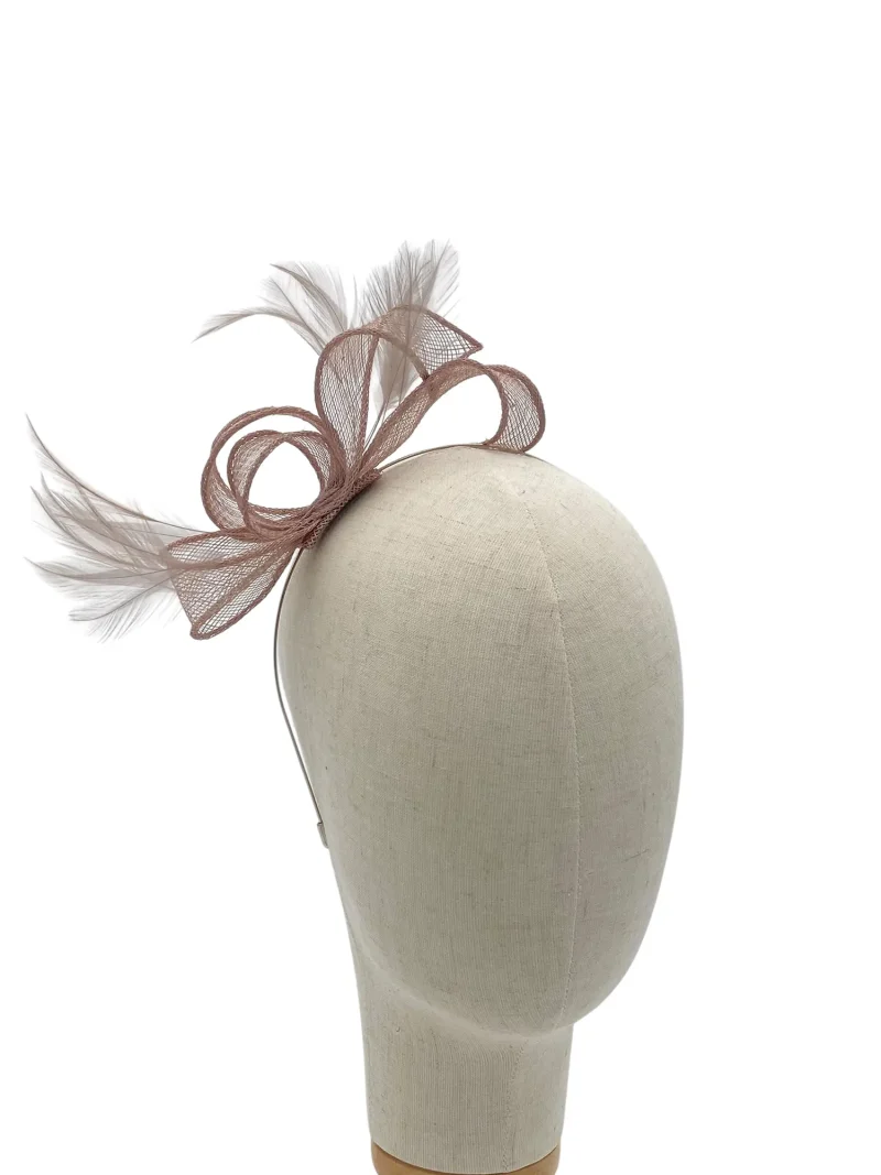 Beige mannequin head wearing a taupe brown mesh fascinator with feathers